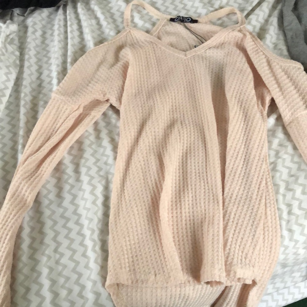 A cute blouse never worn. A cream color size small